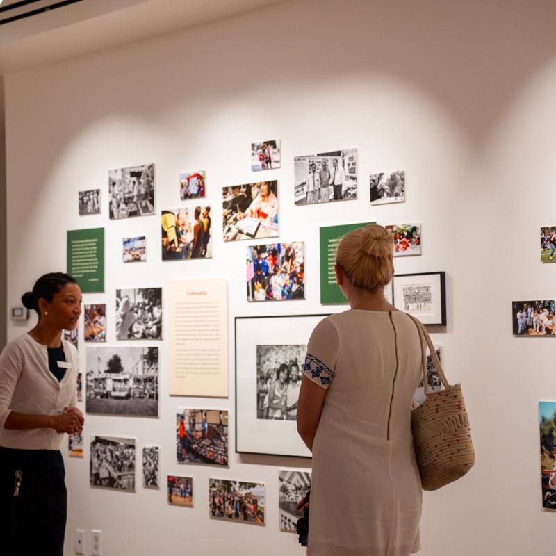 Visitors at a photo exhibition at the Nikkei National Museum